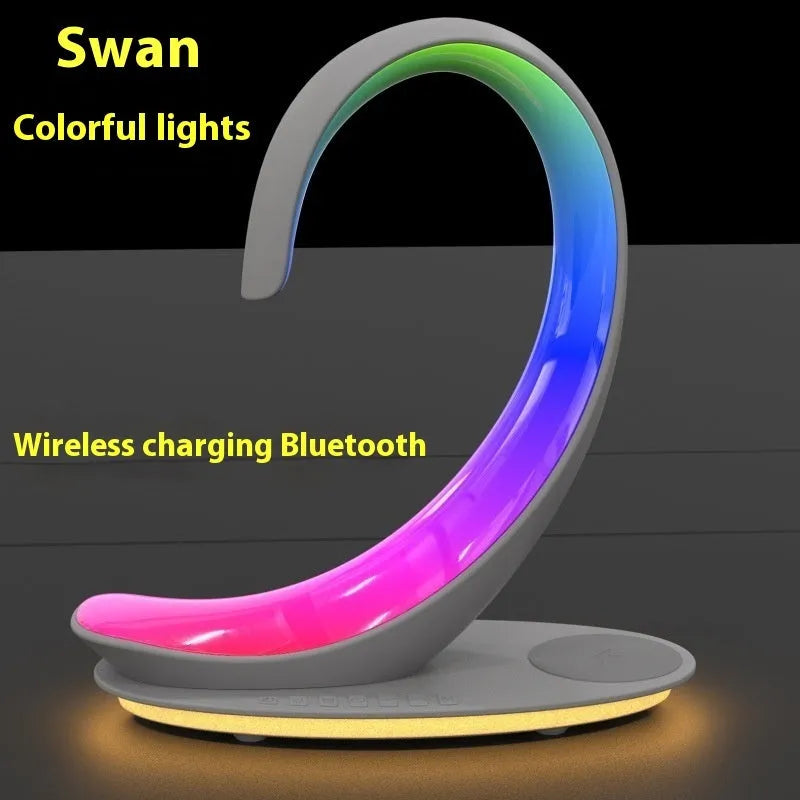 White swan desktop wireless charger with Bluetooth speaker and colourful atmospheric lighting