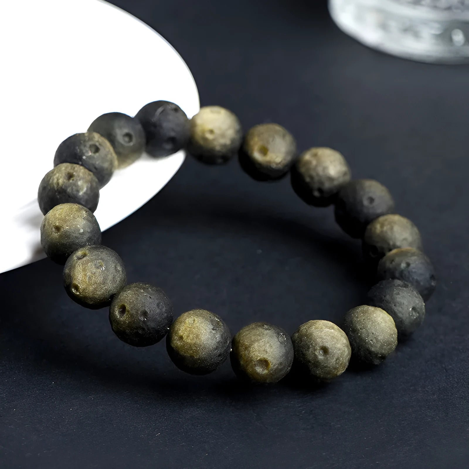 Natural obsidian crater ball bracelet with grinding finish in silver or golden meteorite colours with various bead sizes
