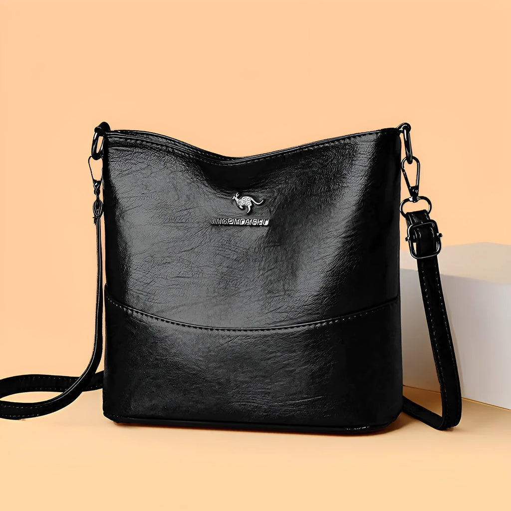 Women's soft leather shoulder bag in bucket shape with sewing line detailing and large capacity