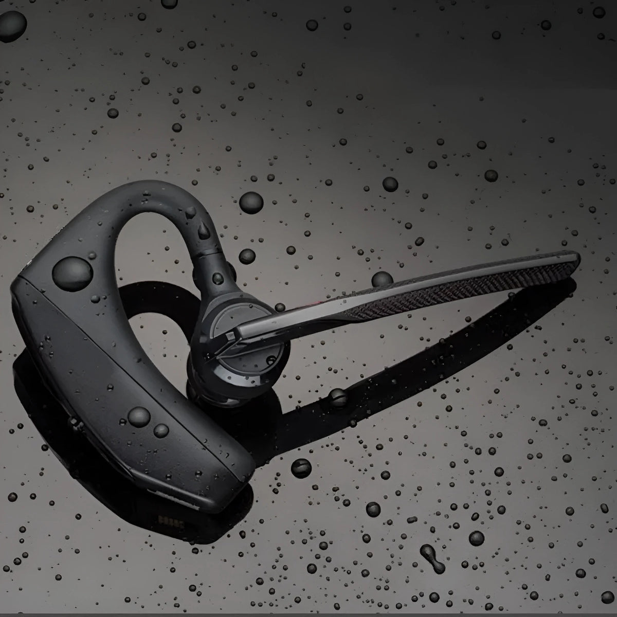Black Bluetooth sports headphones with minimalist design showing battery display and USB connectivity