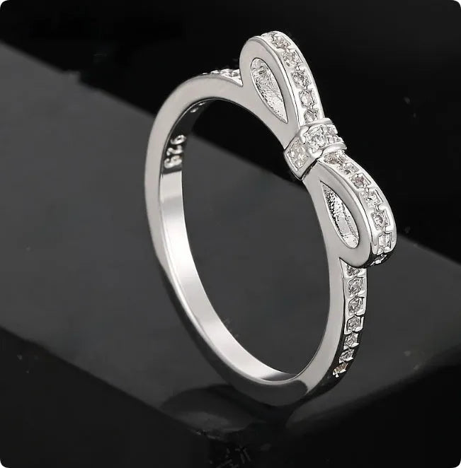 Silver bow-shaped ring with crystal zircon rhinestones in couple style design