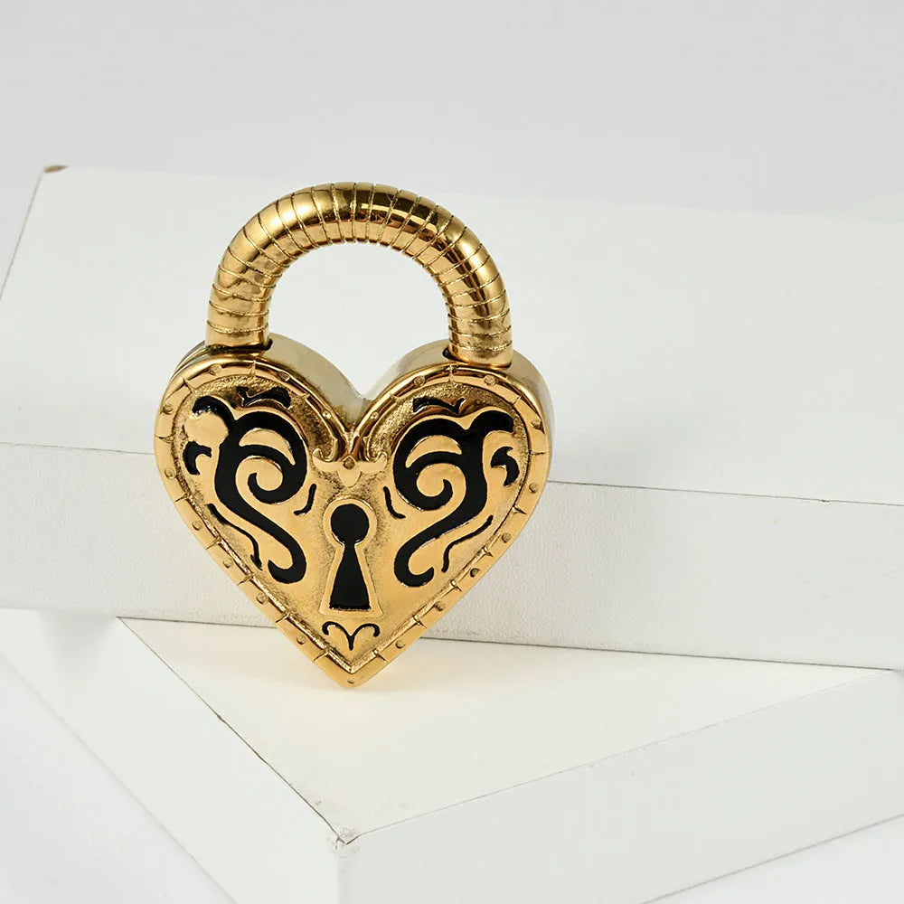 Women's heart-shaped stainless steel earrings in gold or steel colour options for ear piercings