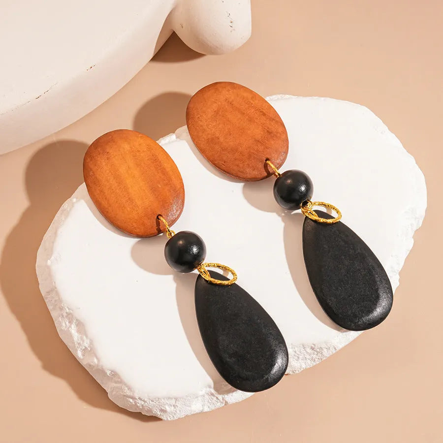 Brown-black wooden retro earrings with elliptical shape and silver needle European American style