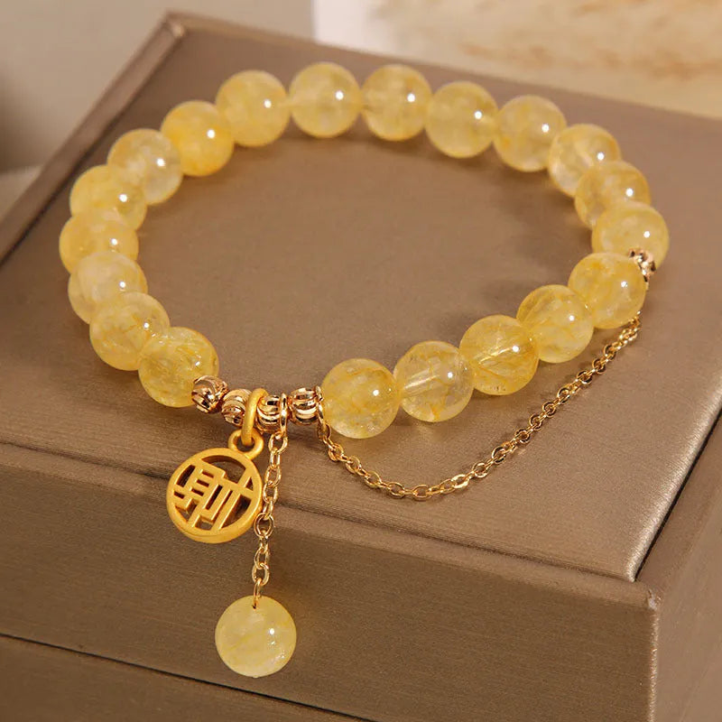 Natural citrine bracelet with Chinese character tassel in gold electroplated finish