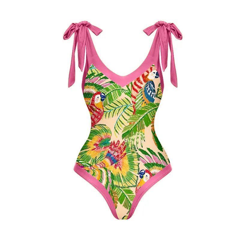 Pink floral print women's V-neck one-piece swimsuit with a thin skirt.
