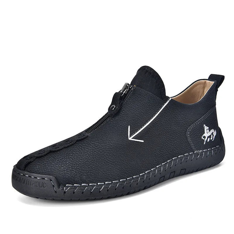 Men's black zip-up casual leather boots with round toe and hand-stitched rubber sole.