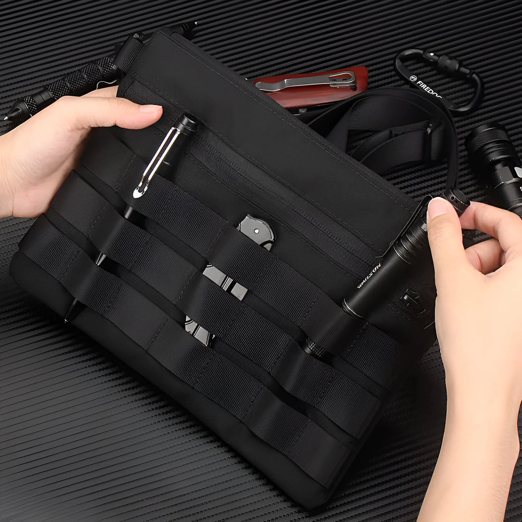 Black Oxford cloth military kit bag showing compact 18cm by 3.5cm size.