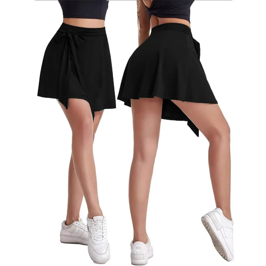 Black thigh-length sports skirt with built-in shorts and high waist design