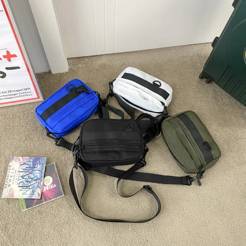 Men's nylon messenger bag in black, blue, green, or white with crossbody strap and street style design