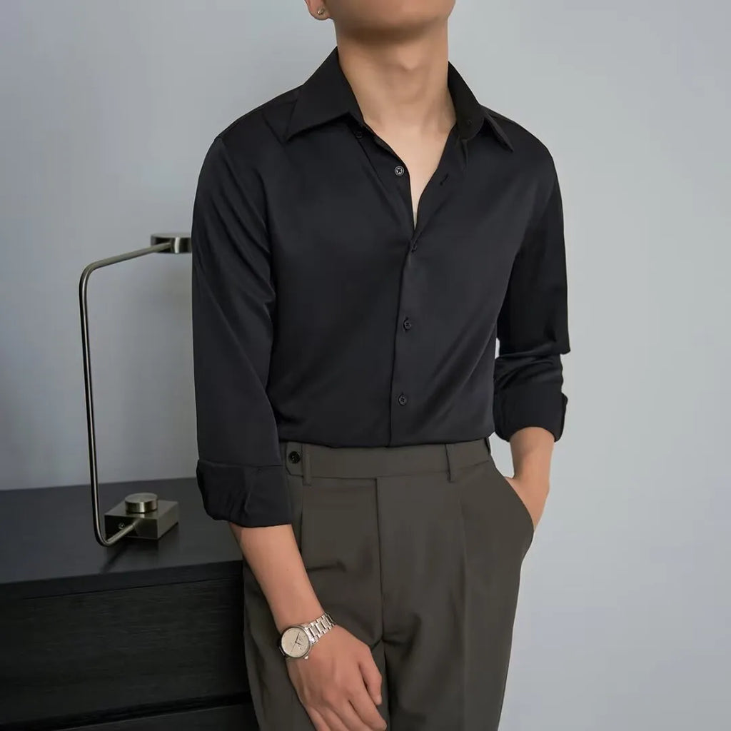 Man wearing a black loose-fit Korean style long sleeve cardigan shirt with Japanese retro design details.