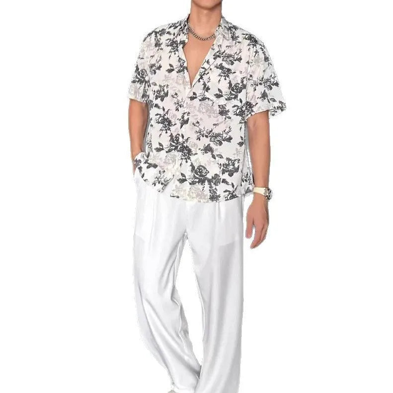 Loose-fitting printed casual shirt with floral pattern and short sleeves in black or white