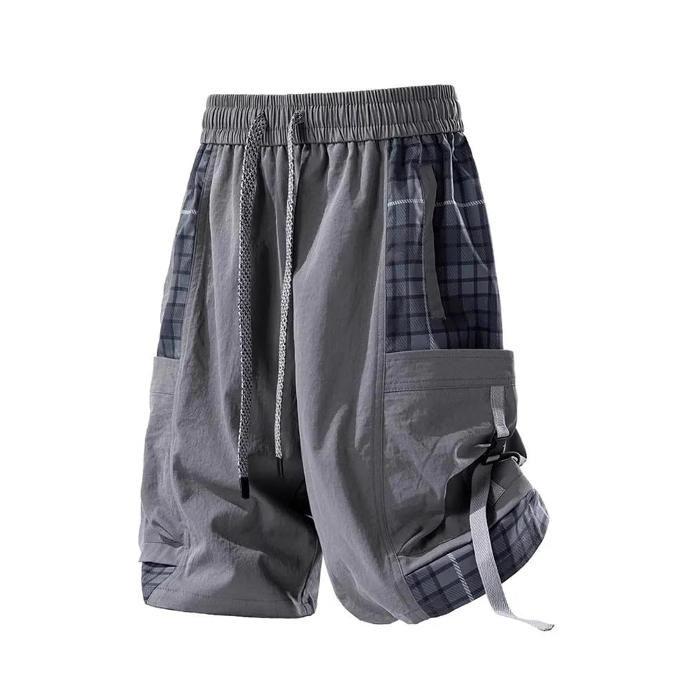 Men's loose fit cargo shorts with plaid stitching detail in black, light grey, and smoky grey.
