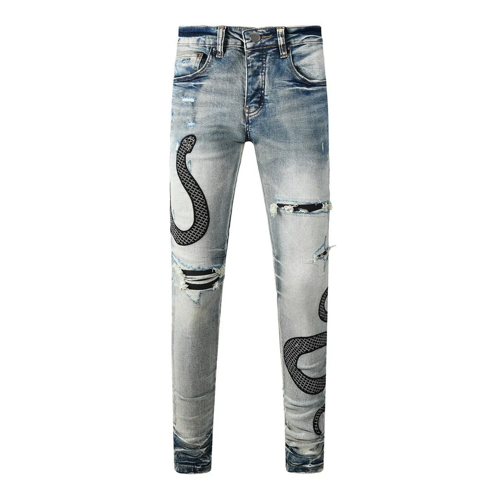 Men's blue distressed skinny jeans with wash finish showing button fly and slim fit
