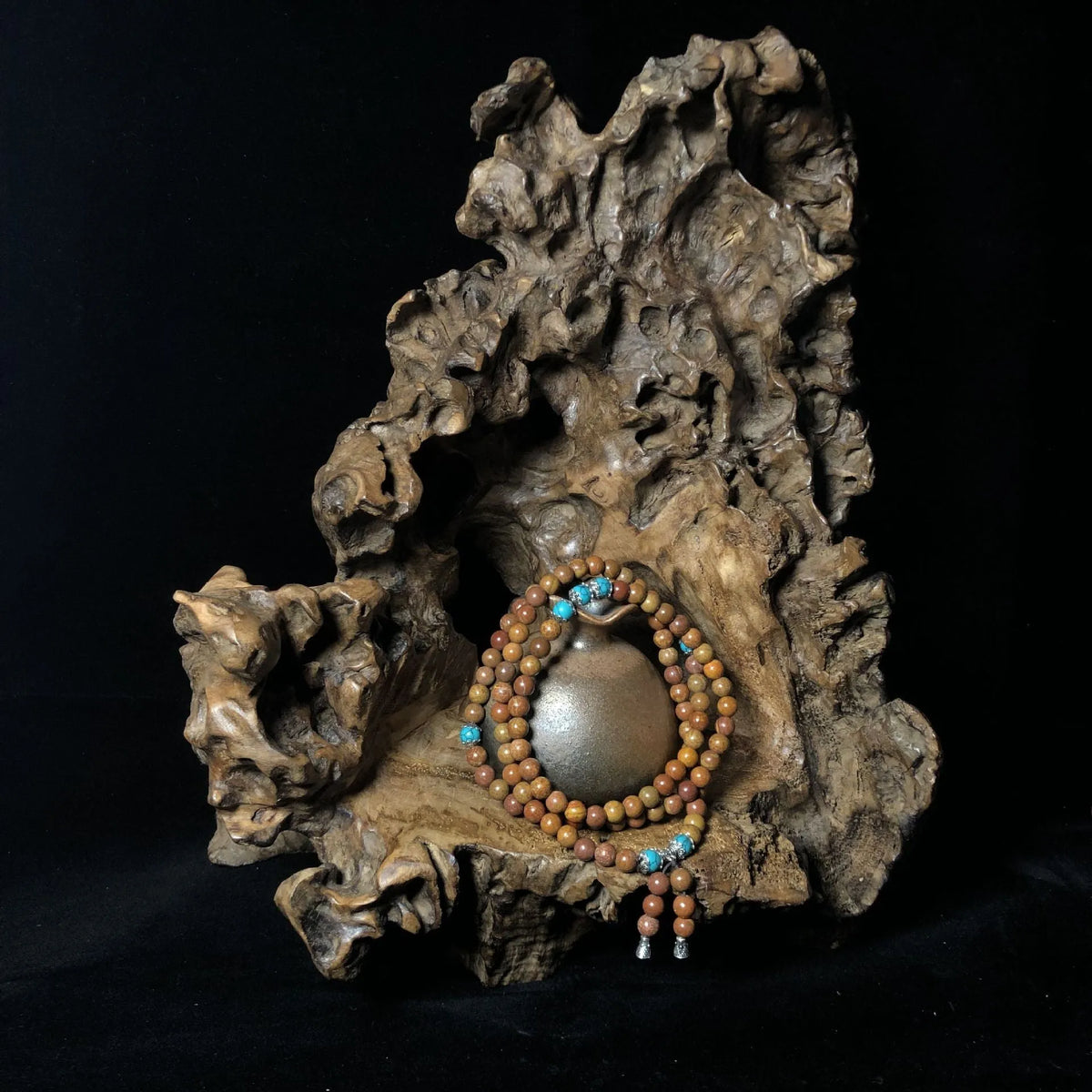 Stone bracelet with 108 geometric beads showing hand-polished finish