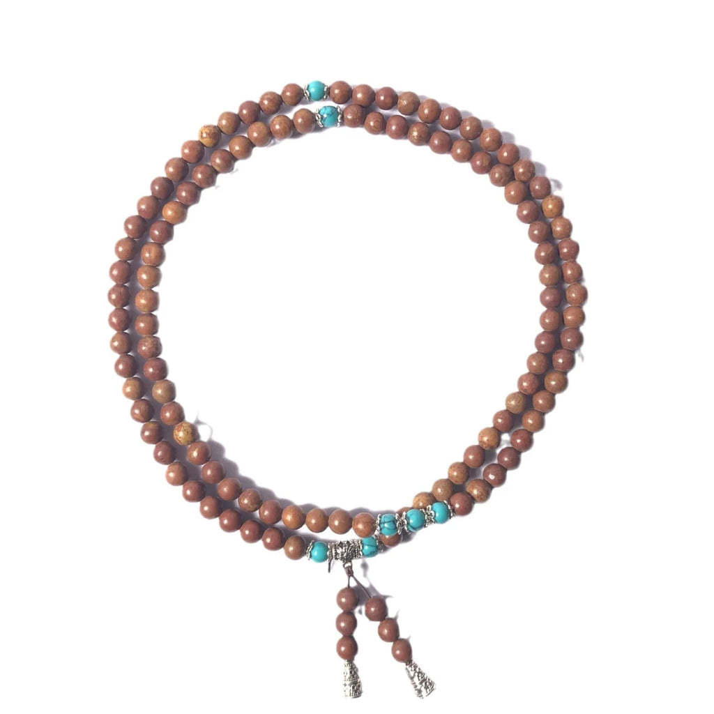 Stone bracelet with 108 geometric beads showing hand-polished finish