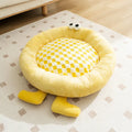 Elf Briquettes blue plush kennel-style dog bed mat with raised edges.