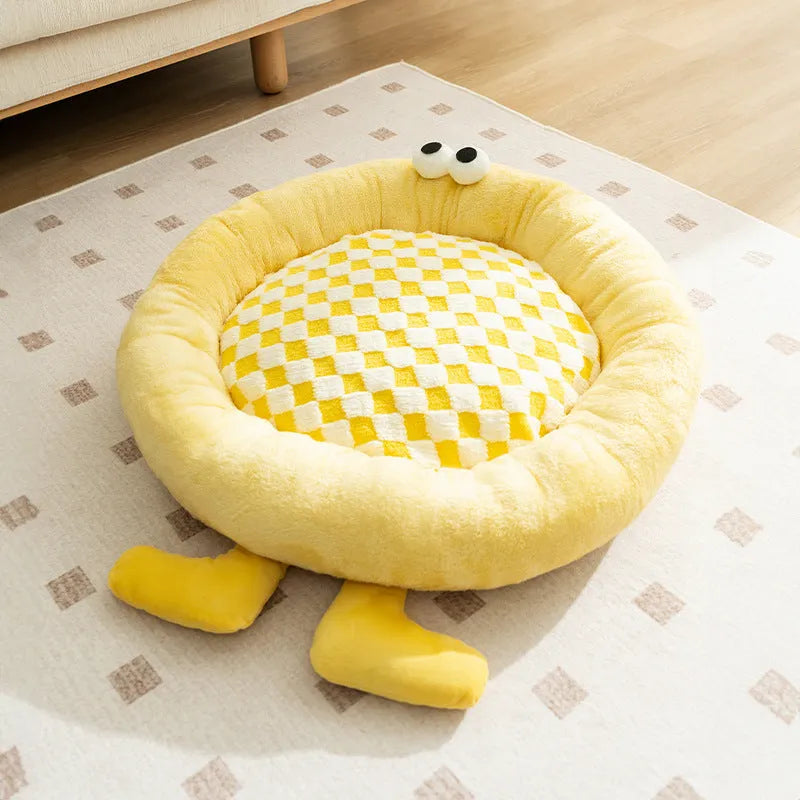 Elf Briquettes blue plush kennel-style dog bed mat with raised edges.