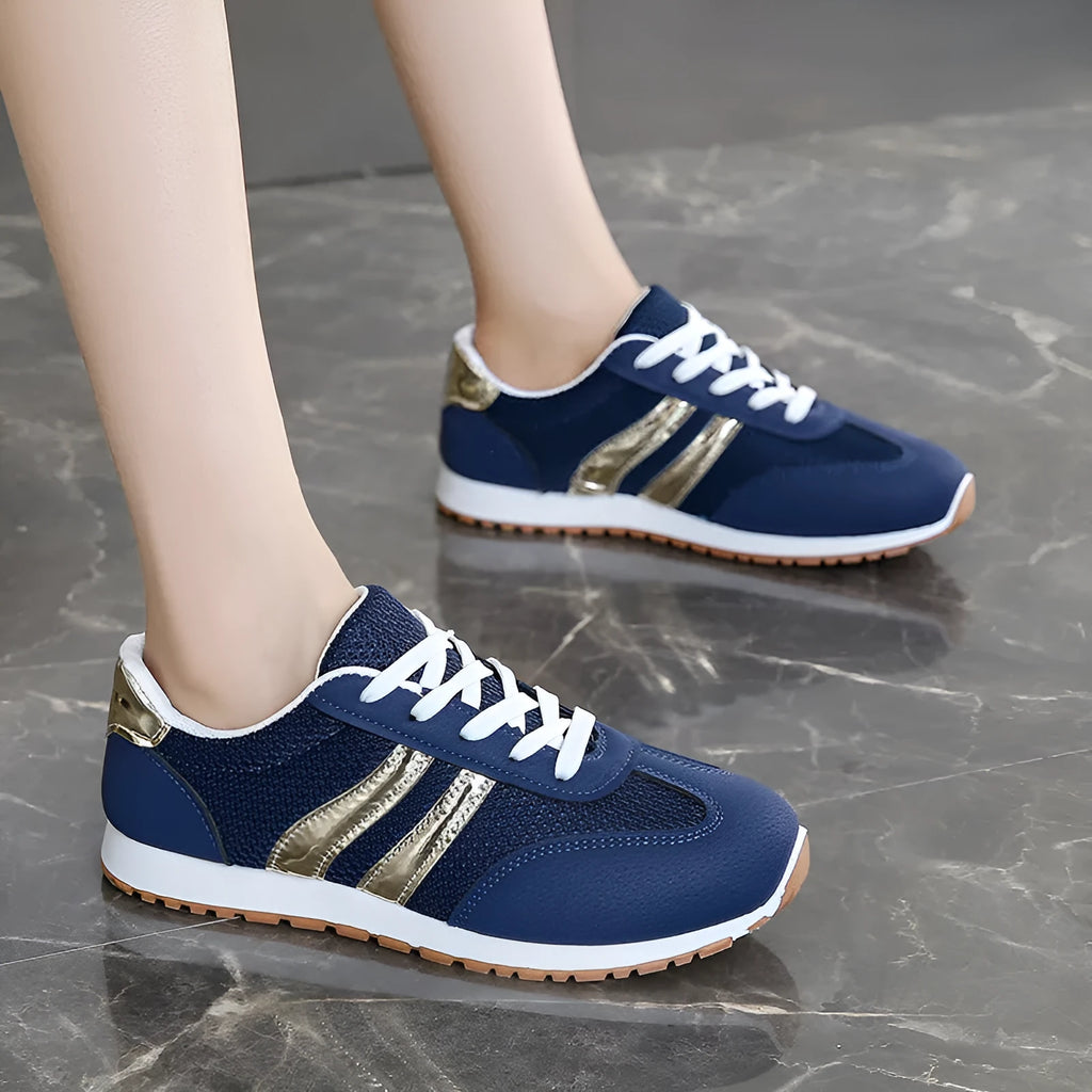 Blue women's casual sports trainers with cross shoulder straps and a white non-slip rubber sole.