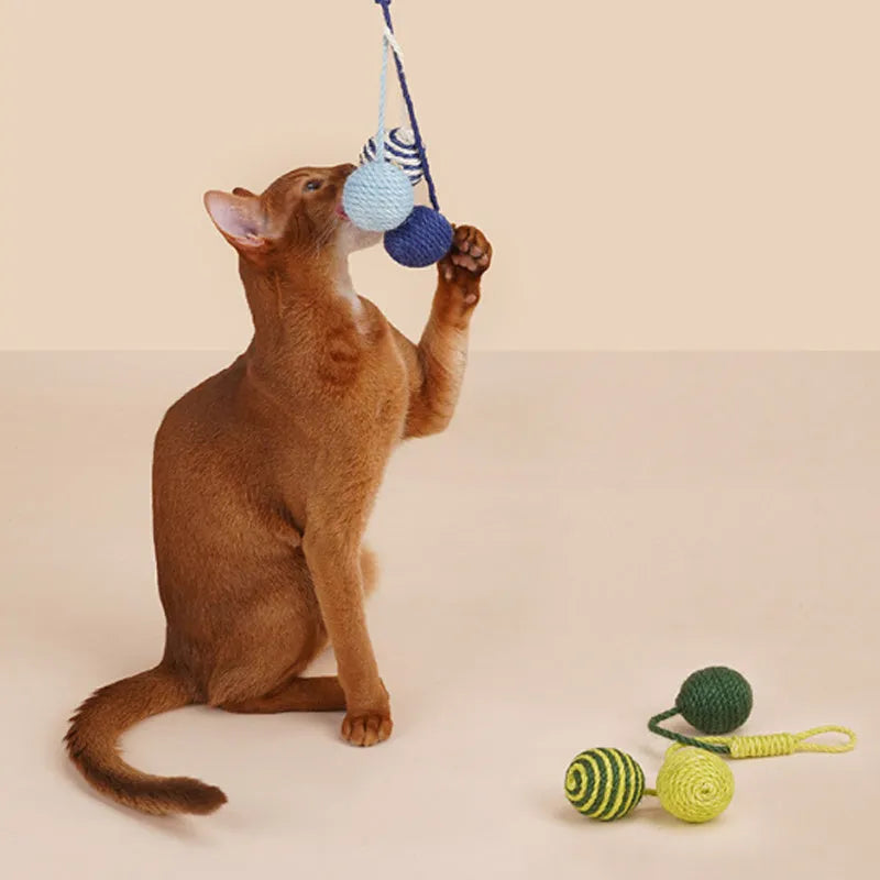 Bite-resistant cat teaser stick with wire core and three attached colourful catnip balls.