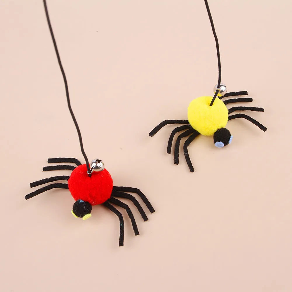 Red and yellow cat hanging door toy with elastic rope, feather, bell, and spider attachment