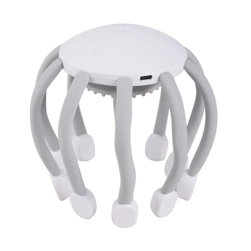 Black electric head massager with eight silicone-tipped claws extending from central handle