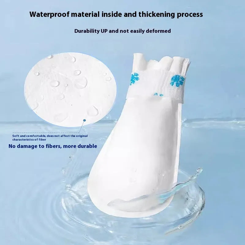A pack of 20 white disposable waterproof dog booties made from non-woven fabric, shown in S and M sizes.