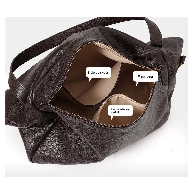 Brown genuine leather women's commuter shoulder bag with horizontal square shape showing internal zippered compartment