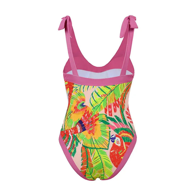 Pink floral print women's V-neck one-piece swimsuit with a thin skirt.