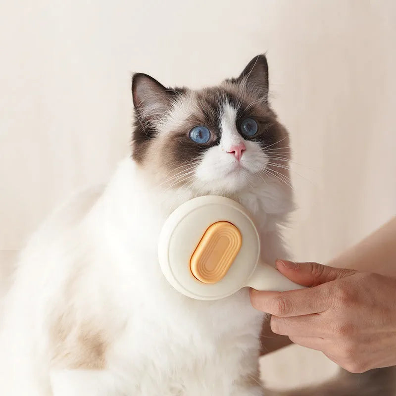 Green pet grooming brush with stainless steel teeth and non-slip handle for cats and dogs