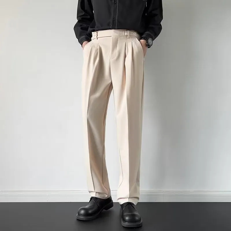 Men's straight-leg loose-fit suit trousers in apricot colour on a hanger.