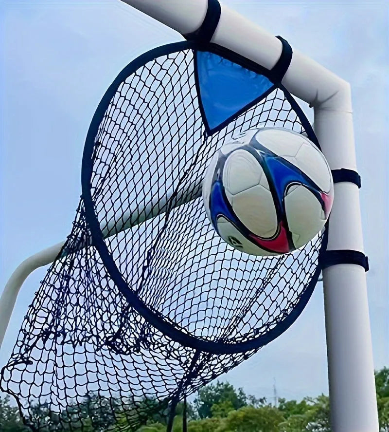 A portable black and yellow soccer training goal net with a steel frame set up on grass.