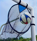 A portable black and yellow soccer training goal net with a steel frame set up on grass.