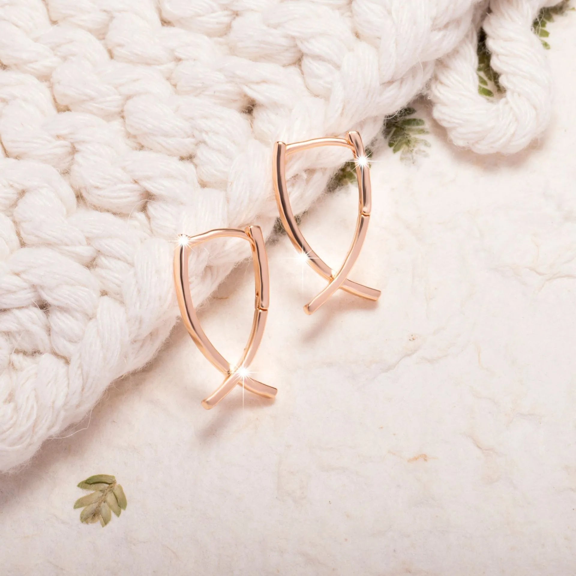 Rose gold cross shaped copper earrings with minimalist design and light luxury finish