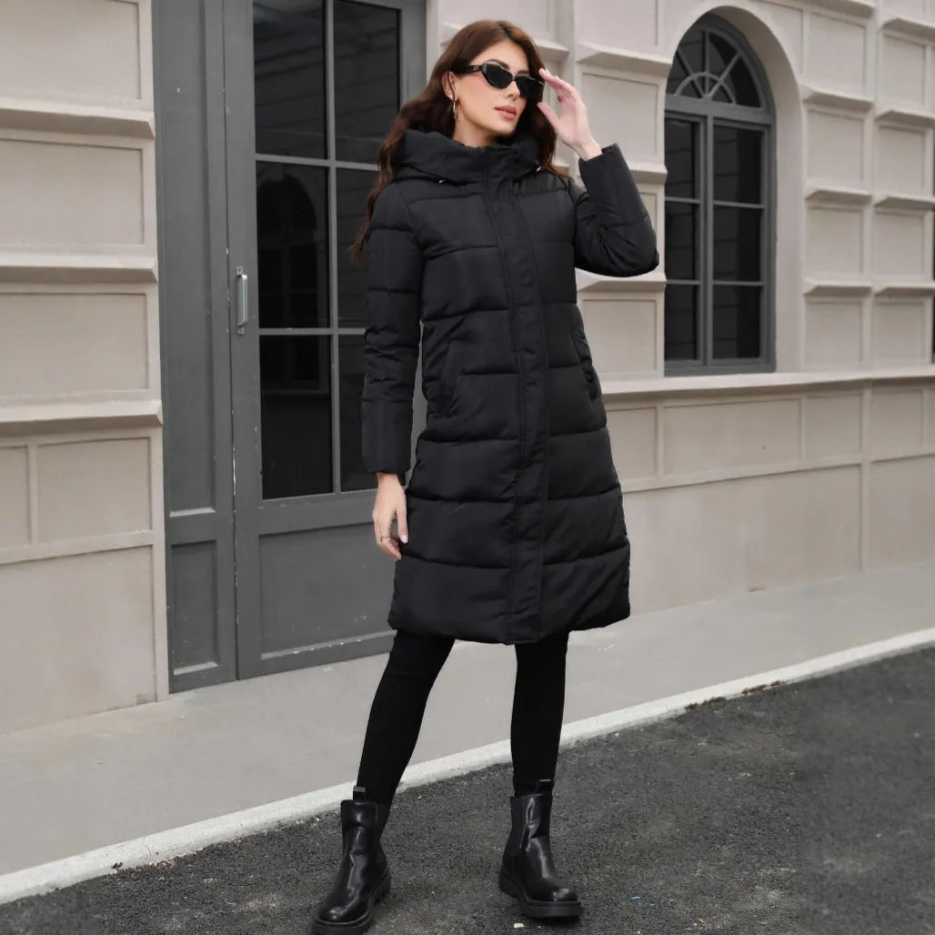 Black slim fit hooded jacket with long sleeves on a hanger.