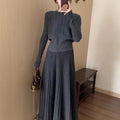Dark grey knitted dress and skirt suit with a 3D pattern and ethnic collage stitching.