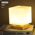 Nordic solid wood USB table lamp showing touch dimming and available shape options including cube and cylinder designs.