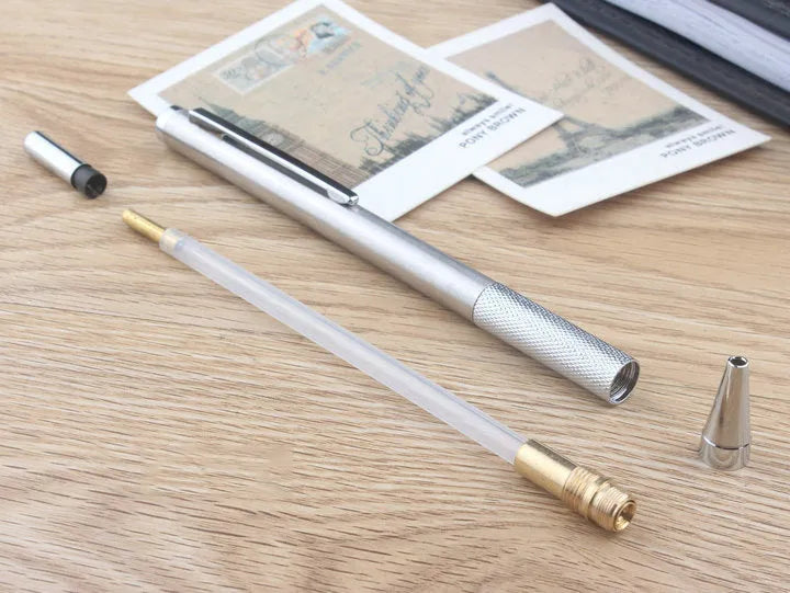 Metal automatic mechanical pencil shown with various lead size options including 0.5mm, 0.7mm, and 2.0mm.