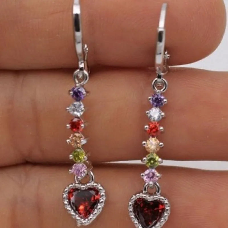 A pair of women's heart-shaped alloy earrings with a gold or silver electroplated finish.
