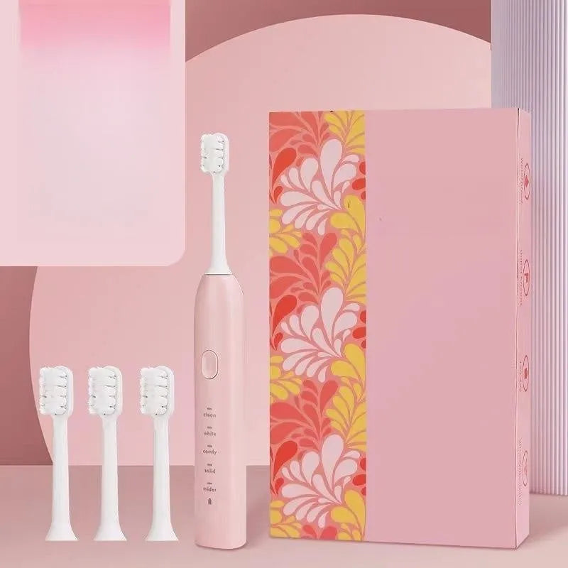 Rechargeable electric toothbrush in yellow with small duck design showing soft bristle brush head