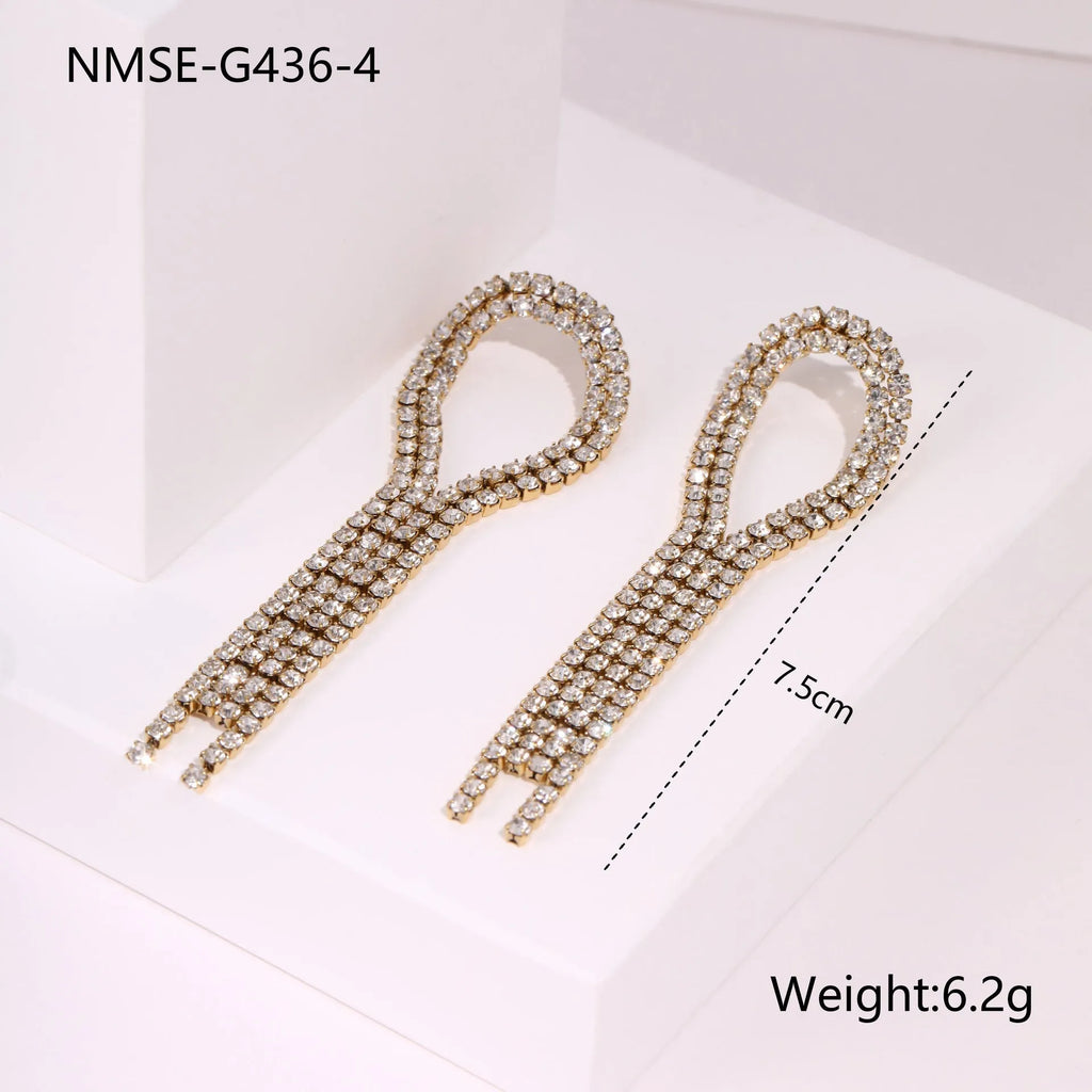 Stainless steel earrings with diamond tassel and heart shapes in 18K gold electroplated finish
