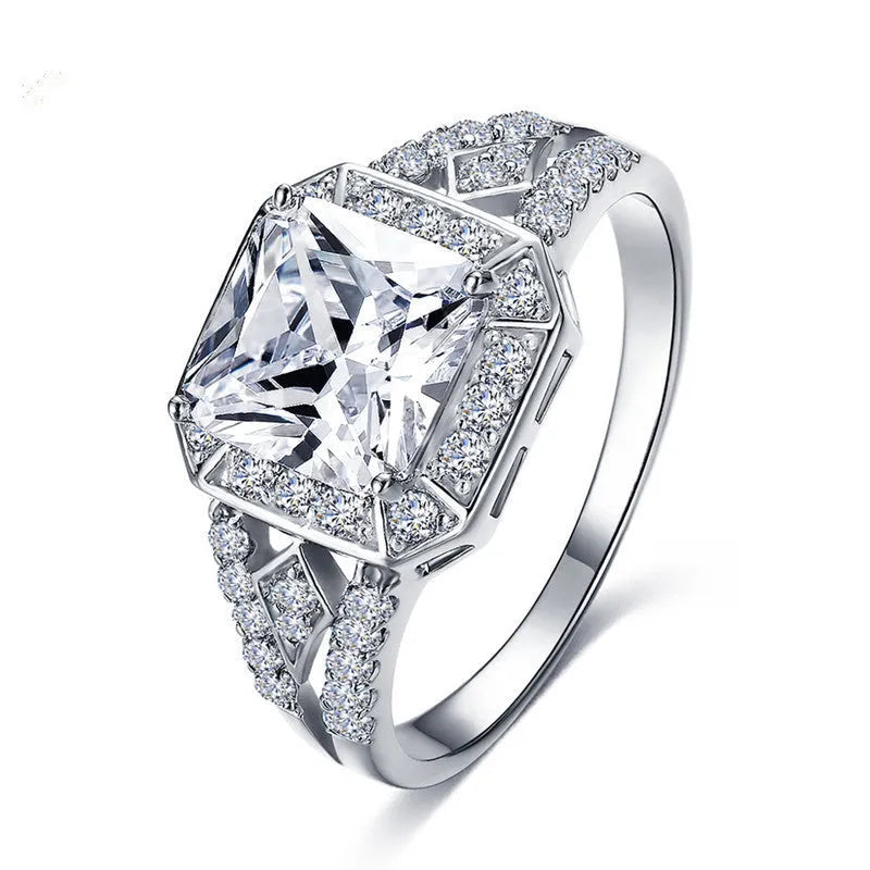 Women's platinum colour geometric zircon ring with hollow ornament design showing quadrilateral pattern