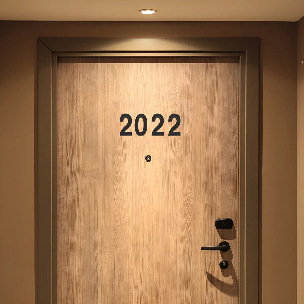 Black stainless steel self-adhesive house number sign showing the digit 7, 7.5cm tall.