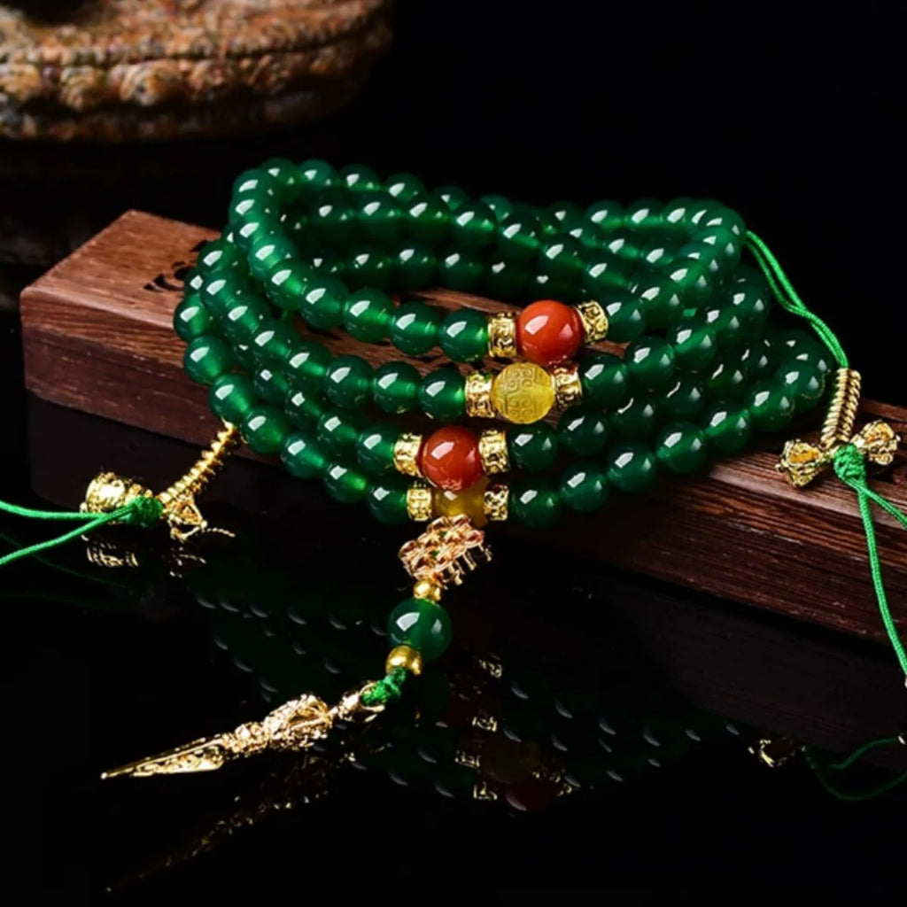 Handmade multi-circle bracelet with green agate beads from Brazil, shown in unisex styling.