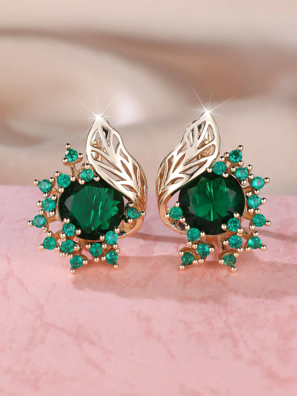 Round flower feather design earrings for women in champagne gold with colourful zircon stone accents.