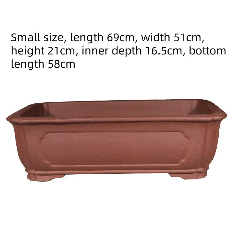 Purple clay rectangular flowerpot showing handmade ceramic texture and rectangular shape