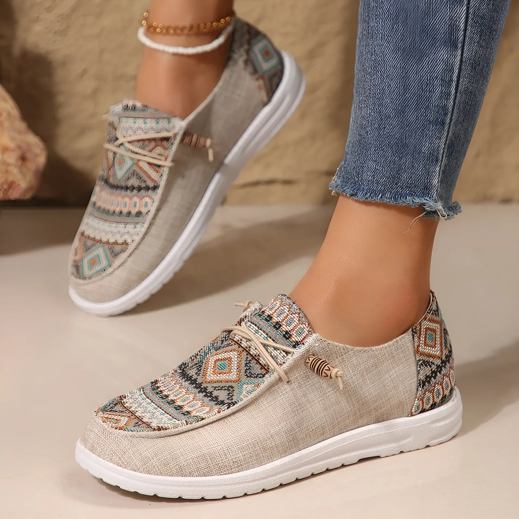 Women's black round toe low-top flat shoes with artificial PU upper and rubber sole on a white background