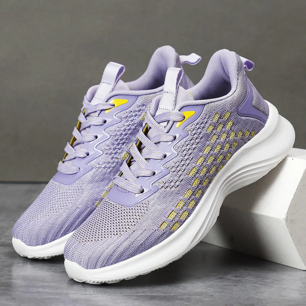 Women's lavender purple Flyknit running shoes with mesh lining and EVA sole, shown in a side view.