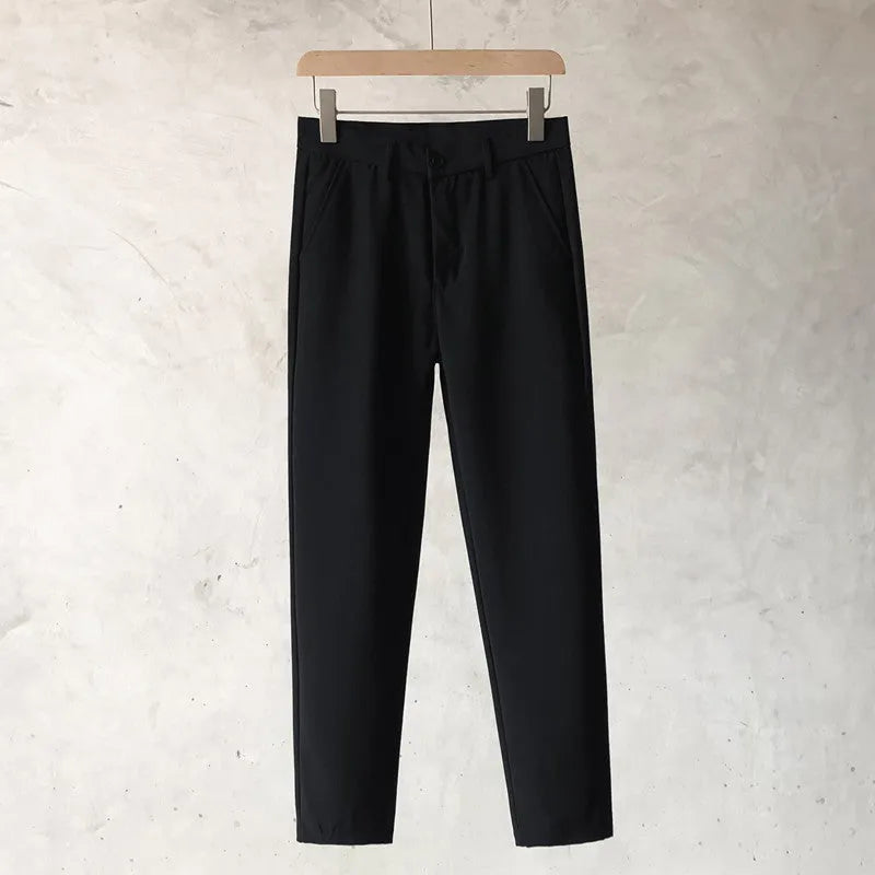 Boys slim straight trousers in wool blend fabric on a hanger, showing tapered leg