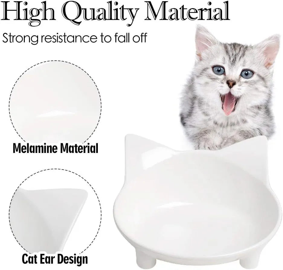 Shallow black melamine pet bowl with a non-slip rubber base on a kitchen floor.