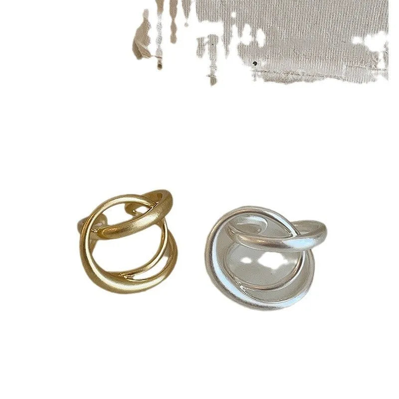 Geometric open ring with three-dimensional interlaced matte metal design and gold electroplating